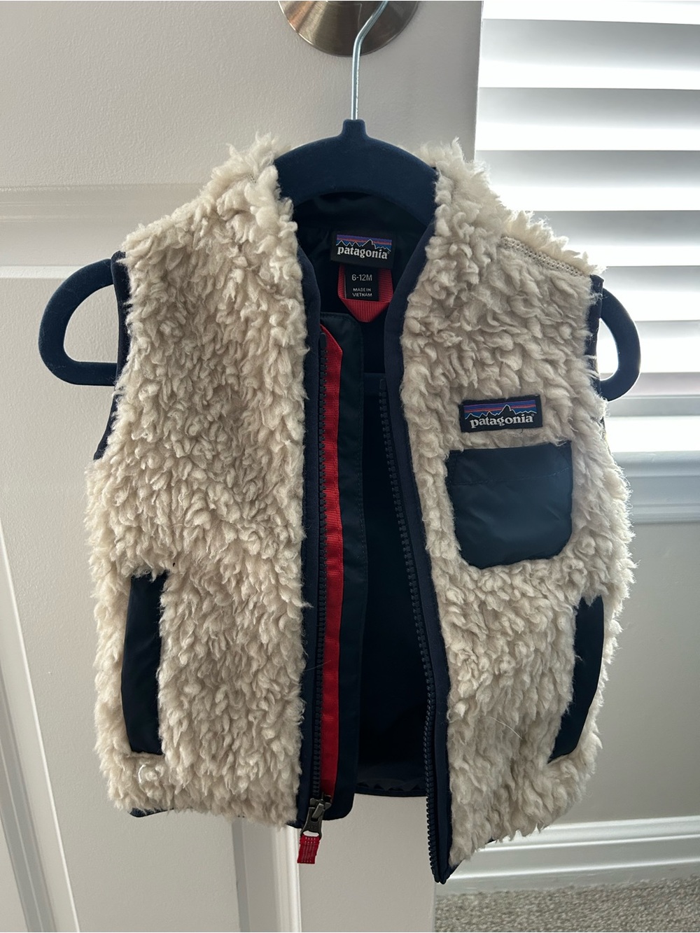 Patagonia Kids Cream Sherpa Vest with Navy Accents and Red Trim